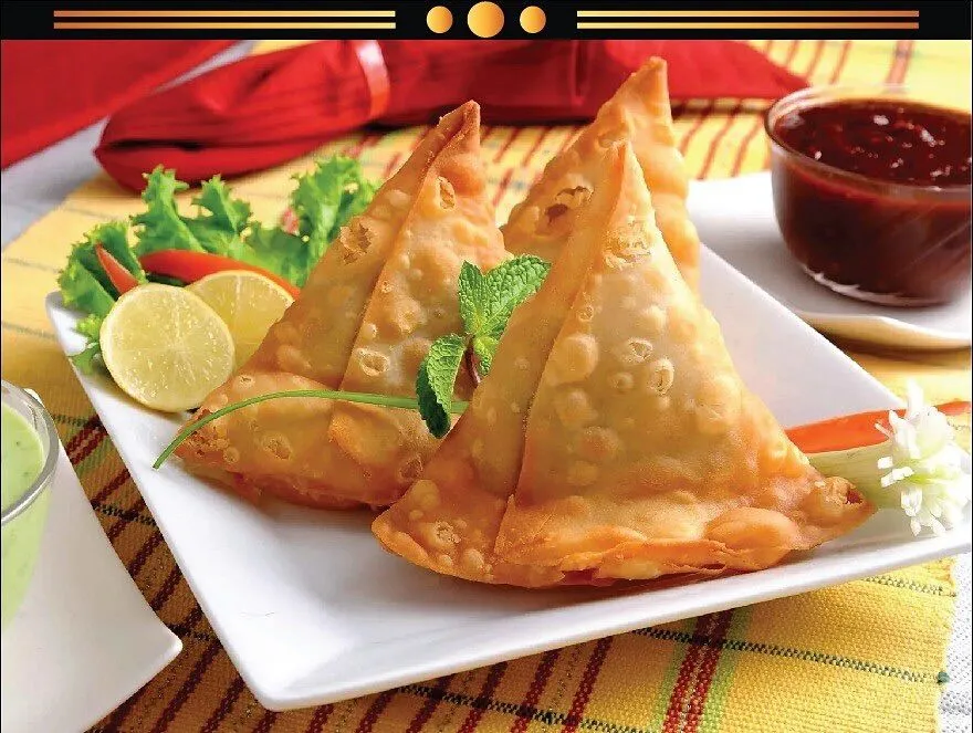 Samosas at Shahi Flames Winnipeg - crispy pastry with spiced potato filling, best samosas in Winnipeg